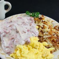 Creamed Chipped Beef · Two biscuits, two eggs, country fries, all on one plate covered with our famous chipped beef...