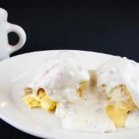 The Haystack® · Two biscuits with country ham, one egg, american cheese, covered with country gravy.

Consum...