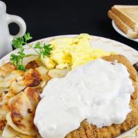 Chicken Fried Chicken · A delicious fried chicken breast covered with our famous sausage gravy with two farm fresh e...
