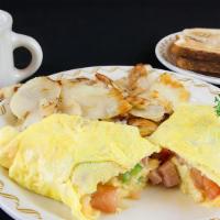 Western Omelette · Served with green peppers, onions, ham, tomatoes and cheese.