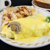 Southern Mushroom Omelette · A country size omelette stuffed with mushrooms, onions and sausage with Monterey Jack & Ched...