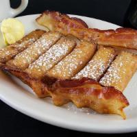 French Toast Sticks · Served golden brown with bacon or sausage.