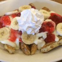 Strawberry & Banana · Our French toast covered with cheesecake filling, strawberry topping, sliced banana and whip...