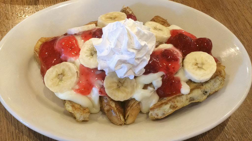 Strawberry & Banana · Our French toast covered with cheesecake filling, strawberry topping, sliced banana and whipped topping.