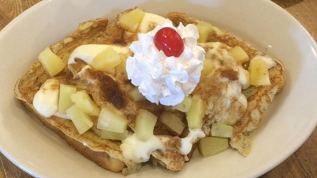 Pineapple Upside Down · Our French toast covered with cheesecake filling, cinnamon, brown sugar, pineapple, whipped topping and a cherry on top.