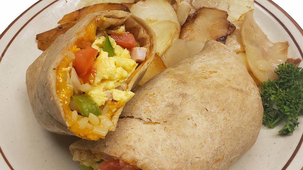 Tj Scramble Wrap · A traditional western mix of scrambled eggs, ham,onions,green peppers, hash browns and cheddar cheese. Served with you choice of potatoes