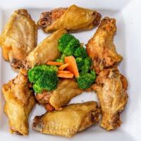 8 Piece Fried Chicken Wings · Cooked wings of a chicken coated in sauce or seasoning.