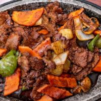 Sizzling Black Pepper Beef · Tender sliced beef with snow peas, onions, carrots, mushrooms in a delicious black peppers s...