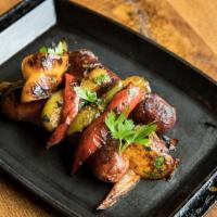 Housemade Italian Sausage And Peppers · house ground pork sausage, tri color bell peppers, caramelized cipollini onions