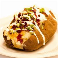 Meat & Veggie Potato · Fresh baked potato mixed with butter, cheese, salt and pepper. 
One meat topping and unlimit...