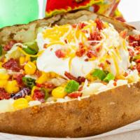 Meat & Veggie Potato Combo (Chips And Drink) · Fresh baked potato mixed with butter, cheese, salt and pepper. 
One meat topping and unlimit...