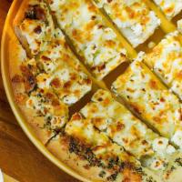 Feta Bread · Mozzarella, muenster, Cheddar, and feta cheeses. Baked to perfection, cut into strips, and b...