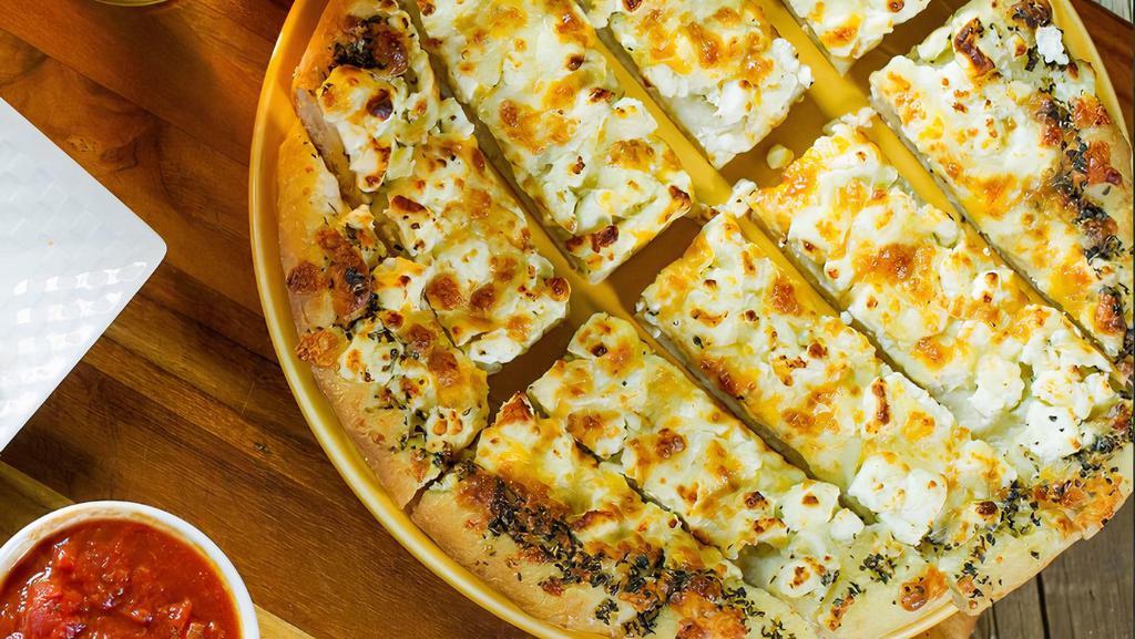 Feta Bread · Mozzarella, muenster, Cheddar, and feta cheeses. Baked to perfection, cut into strips, and brushed with garlic butter and topped with a generous portion of Parmesan.