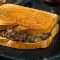 Patty Melt Sandwich · Half pound black angus beef chargrilled medium well. Topped with Swiss cheese, grilled onion...