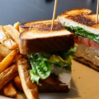 Chicken Salad Club Sandwich · House-made chicken salad, lettuce, tomato, mayo and smoked bacon on sourdough.