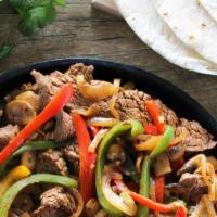 Steak Fajitas · Sautée bell peppers with grilled onions, tomatoes and cilantro & choice of corn or flour tor...