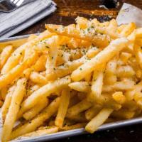 Truffle Fries · Deep fried fries, garlic infused truffle oil, and parsley.