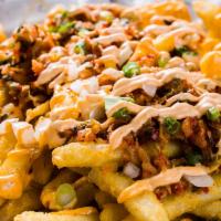 Kimchi Fries · Deep fried fries topped with onion, kimchi, scallion and spicy mayo.