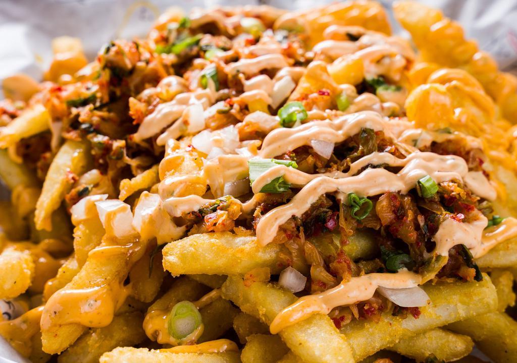 Kimchi Fries · Deep fried fries topped with onion, kimchi, scallion and spicy mayo.