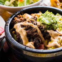 Burrito Bowl · With 2 Deep fried boneless breasts, steamed white rice, beef chilly, corn, pico, jalapeno, g...