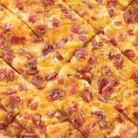 Regular - Bacon Cheddar Bread · An all american favorite. Garlic cheese bread topped with our cheddar cheese, bacon, and Ita...