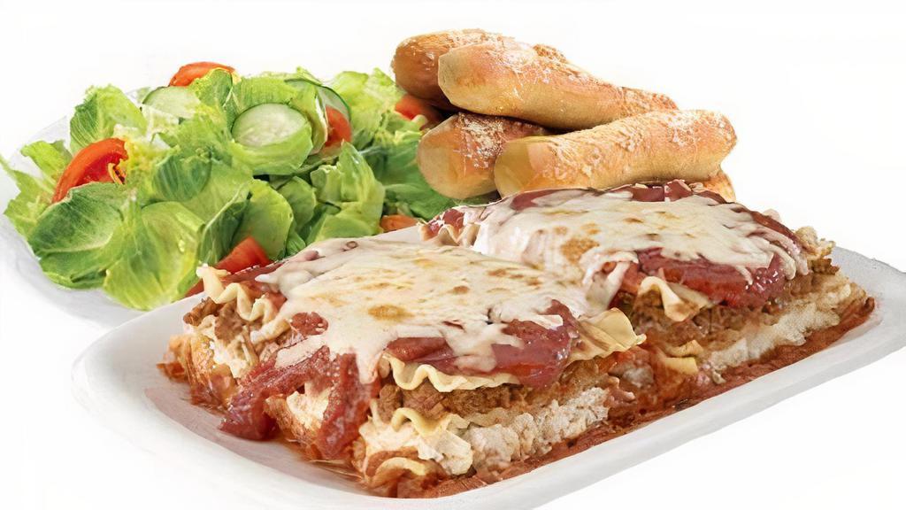 Lasagna Dinner · Lasagna, small stix, and small tossed or caesar salad. Innstix comes with 1 pizza sauce and 1 garlic butter.