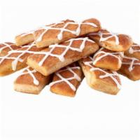 Cinnamon Stix · Oven-baked bread brushed with a cinnamon and sugar mix, smothered with vanilla icing.