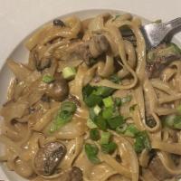 Beef Stroganoff · Fettuccine smothered in strips of beef sauteed in butter with onions, mushrooms and a sour c...