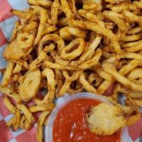 Onion Tanglers · THIN CUT BEER BREADED ONION STRIPS FRIEN GOLDEN BROWN SERVED WITH CHEFS SPECIAL DIPPING SAUCE.
