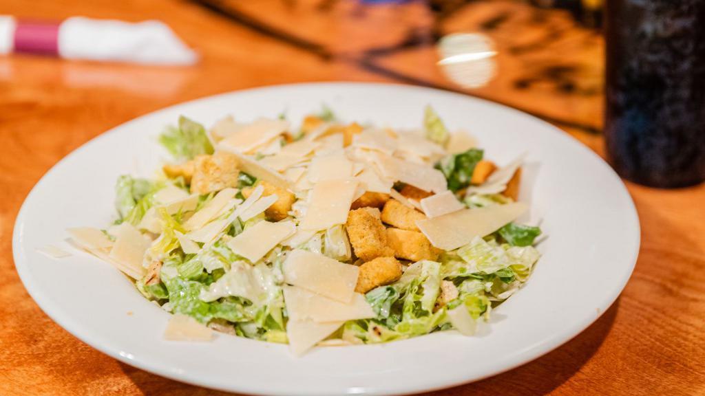 Qb Caesar Salad · ICEBERG AND ROMAINE LETTUCE TOSSED IN CREAMY CAESAR DRESSING TOPPED WITH GRILLED CHICKEN BREAST, SHREDDED PARMESAN CHEESE AND CROUTONS