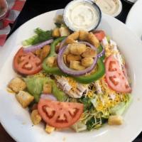 Home Turf Salad · ICEBERG AND ROMAINE LETTUCE TOPPED WITH TOMATO, SLICED CUCUMBER, RED ONIONS, AND  YOUR CHOIC...