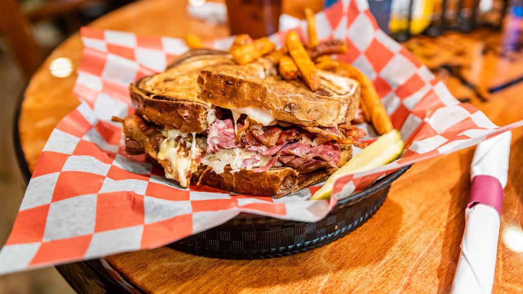Big A** Reuben · Grilled rye bread loaded with swiss cheese, sauerkraut thousand island and corned beef.