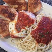 Chicken Parmesan · TENDER BREADED CHICKEN BREAST SERVED ON SPAGHETTI NOODLES WITH OUR HOMEMADE SAUCE