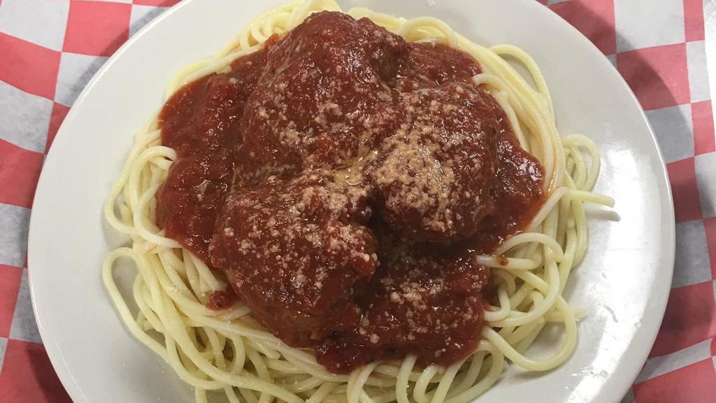 Spaghetti And Meatballs · A GENEROUS PORTION OF SPAGHETTI NOODLES WITH OUR HOMEMADE SAUCE TOPPED WITH MEATBALLS AND A SIDE OF GARLIC BREAD.