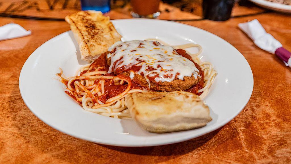 Veal Parmesan · TENDER BREADED VEAL SERVED ON SPAGHETTI NOODLES WITH OUR HOMEMADE SAUCE