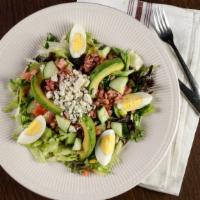 Cobb Salad · Mixed greens, crumbled bleu cheese, hard-boiled egg, tomato, avocado, cucumber, and diced ba...