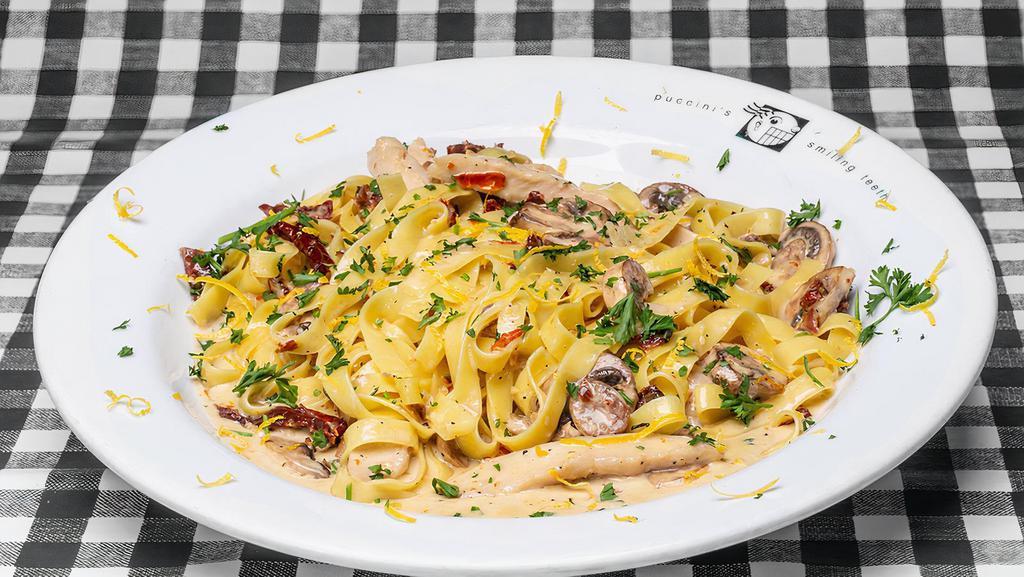 Rosemary Cream Chicken · Owners’ favorites. Sautéed slices of chicken in a rosemary cream sauce accented with mushrooms and sun-dried tomatoes served on fettuccine.
