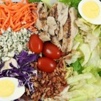 Cobb Salad · Mixed Greens, White Chicken Meat, Hard Boiled Egg, Grape Tomatoes, Cheddar and Monterey Jack...