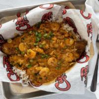Loaded Blackened Fish · A blackened fish filet served over white rice. Loaded with sautéed shrimp, crawfish, onion, ...