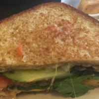 Grilled Veggie Sandwich · Melted swiss and American cheese on grilled multigrain bread, with mushrooms and onions, top...