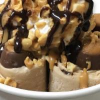 Buckeye Madness · Peanut Butter & Choc Base, 	
	
Mixed Ins:
Peanut Butter & Choc	,
	
	
Toppings	:
Whipped Crea...