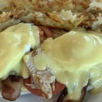 Classic Benedict · Two poached eggs and Canadian bacon on an English muffin, topped with hollandaise sauce.