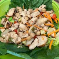 Asian Chicken Wraps · Two rolled Romaine leafs with a hot filling of all-natural marinated chicken, fresh red pepp...