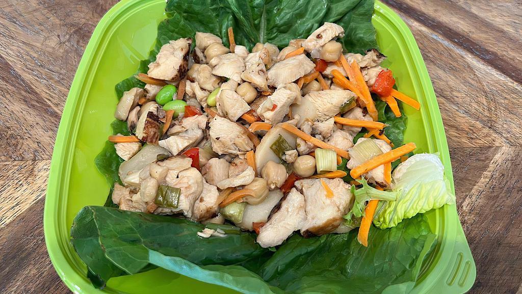 Asian Chicken Wraps · Two rolled Romaine leafs with a hot filling of all-natural marinated chicken, fresh red peppers, crunchy water chestnuts, garbanzo beans, green onions, and shredded carrots.