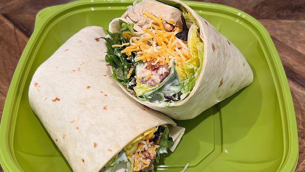Kid'S Bacon Chicken Ranch Wrap · All-natural chicken breast, crispy bacon, cheddar jack cheese and creamy homemade ranch dressing wrapped in a flour tortilla. Served with lemonade and string cheese.