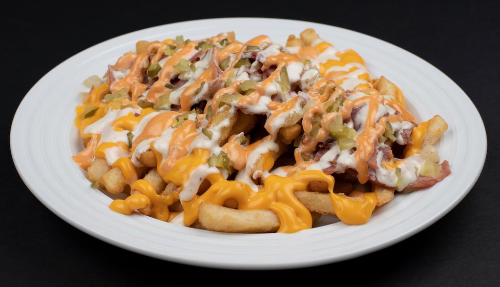 Full Loaded Fries · bacon, chicken bites, tomatoes, green peppers, pickles, onions, mozzarella cheese, cheddar sauce, ranch dressing, BBQ sauce