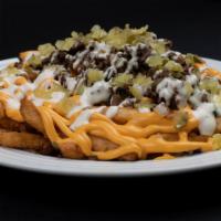 Beef Fries · 1/2 lb beef, onions, pickles, cheddar sauce, ranch dressing