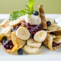 Blueberry Banana Crepe · Filled with banana, blueberry compote & topped with vanilla cream cheese, creme anglaise