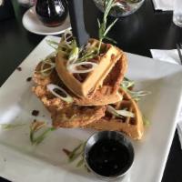 The Tower Waffle · Spicy. Pepper bacon waffle, fried chicken topped with chopped bacon, scallions and spicy syrup