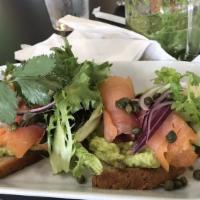 Avocado Toast · Mashed avocado, smoked salmon, capers, red onions, cucumber on gluten free bread. Fruit or s...